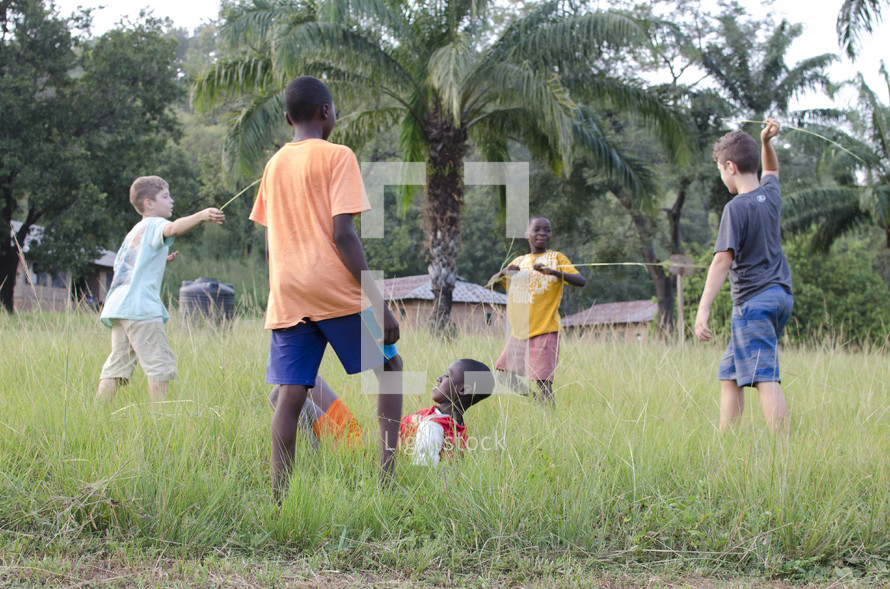 children playing outdoors in a village 