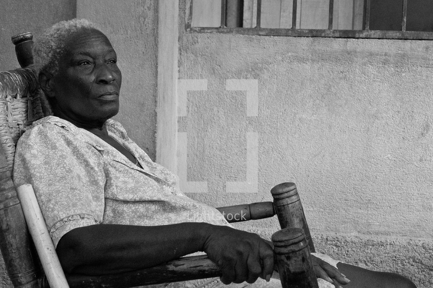 an elderly woman in a rocking chair 