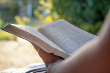 a person reading a Bible 