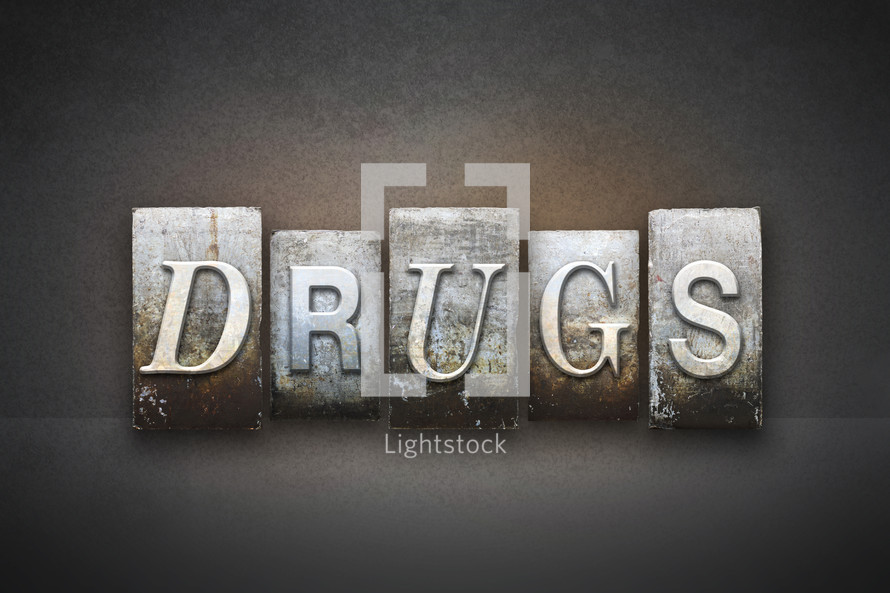 Stone tiles spelling the word DRUGS.