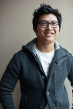 portrait of an Asian man with glasses 