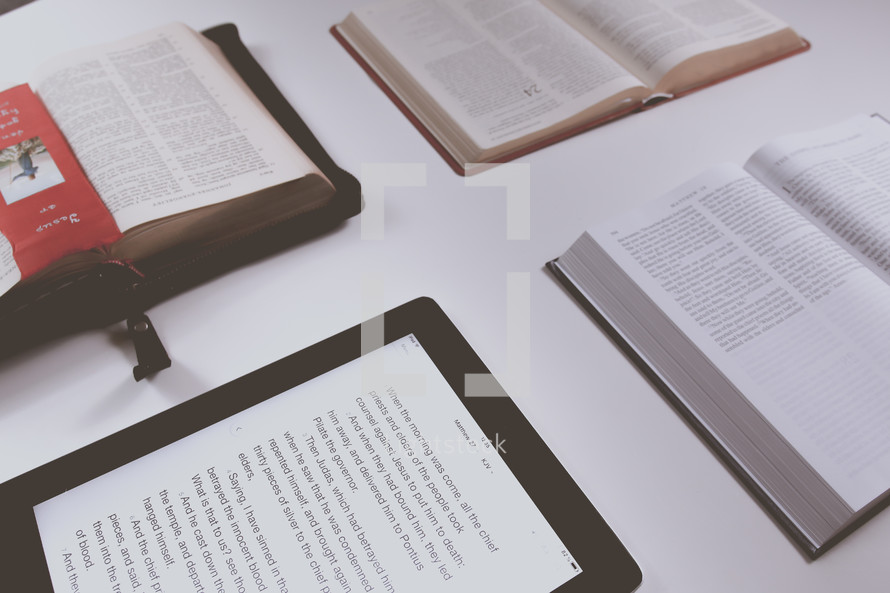 tablets and open Bibles on a table for a Bible study 