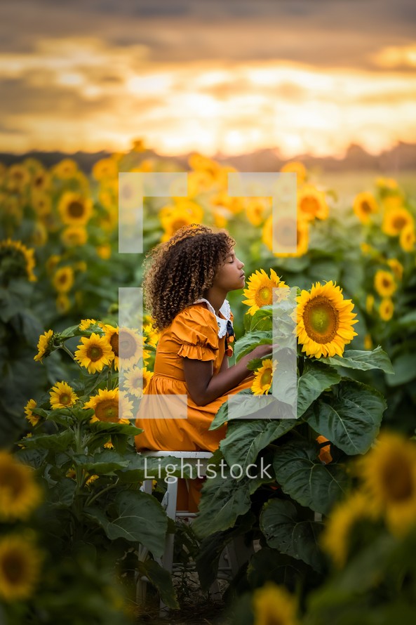 a girl in a field of sunflowers 