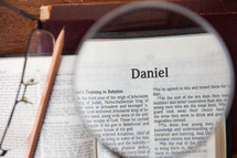 magnifying glass over Daniel 