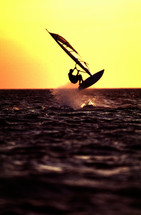 silhouette of a wind surfer at sunset 