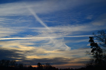 streaks in the sky at sunset 