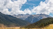 Beautiful clouds sky over alpine mountains landscape in wild nature of New Zealand Time-lapse
