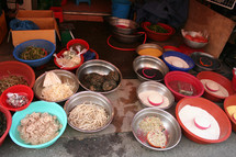grains and vegetables in bowls in a market 