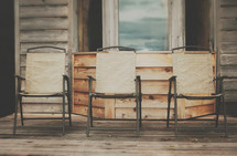 wood chairs on a porch 