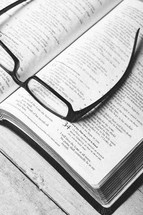 reading glasses on a Bible - seeking clarity