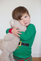 toddler hugging a stuffed animal 