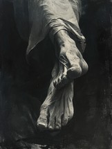 Statue of Jesus Christ with bare feet on a black background.