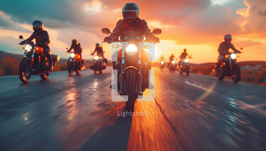 Motorcyclists riding on the road at sunset. Biker on a motorcycle.