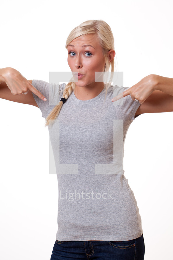 young woman pointing to herself 