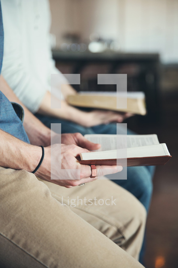men reading Bibles at a Bible study 