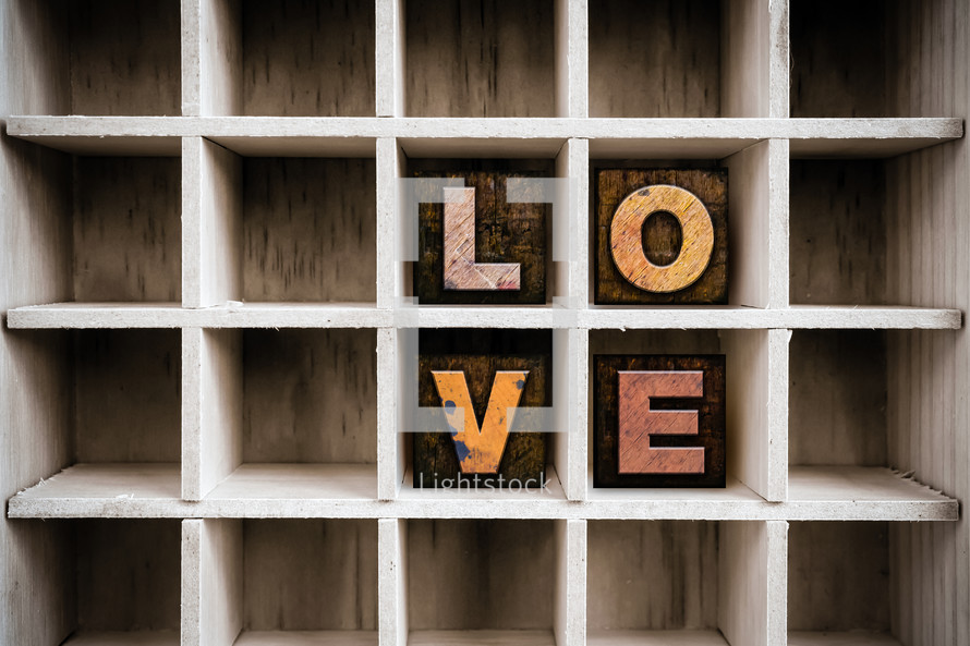 word love on a wood shelf 