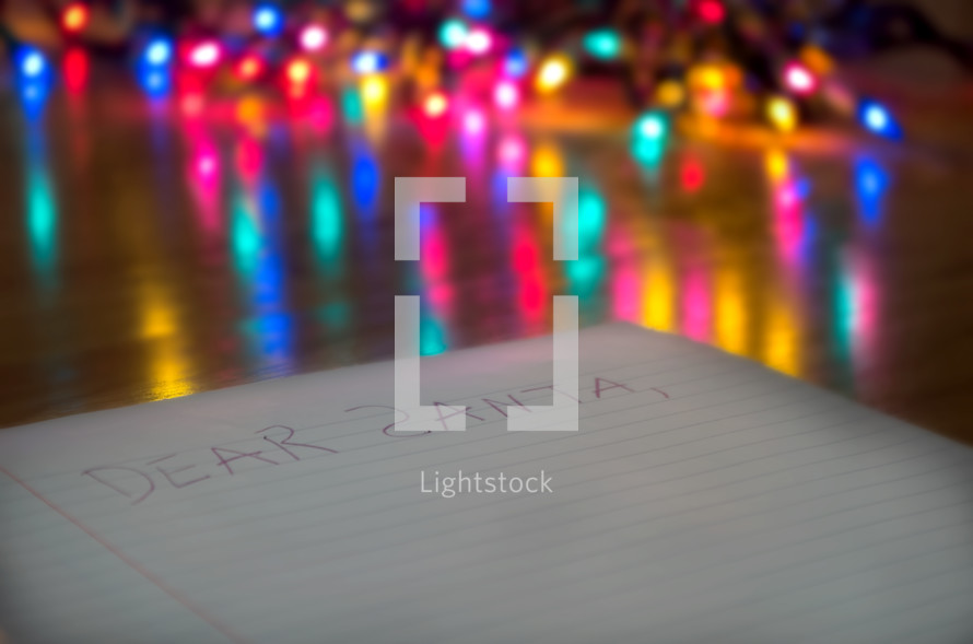bokeh colored Christmas lights and a note to Santa 
