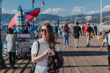 happy woman standing on a pier 