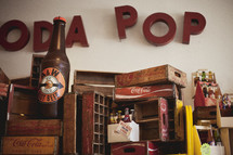 antique soda pop bottles and crates