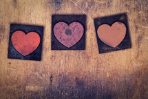 three wood heart stamps