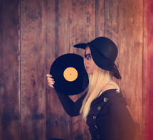 a woman holding a record 
