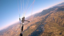 Panoramic view of free flight paragliding high above mountains nature in sunny spring adrenaline adventure freedom

