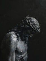 Statue of Jesus Christ with crown of thorns on his head, dark background.