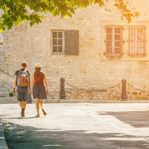 couple walking in Arles, France