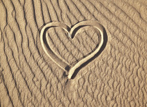 heart drawn in sand 