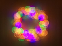Christmas light decorations form the shape of a wreath