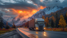Truck traversing mountainous terrain during a picturesque sunset