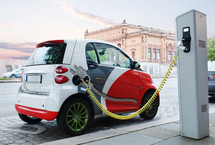 Electro car is charging on the street
