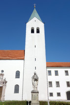statues and white steeple 