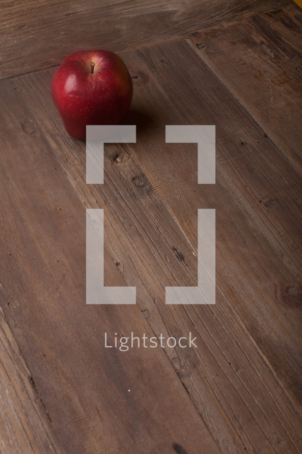 apple on a wood table 