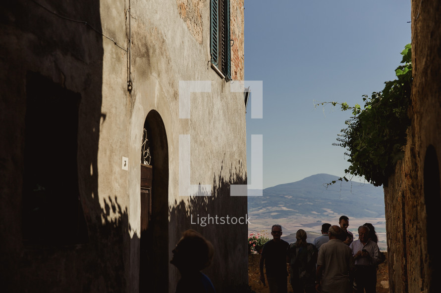 people gathered in front of a chapel in Italy 