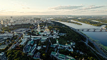 Kyiv, Ukraine - September 2022: aerial drone view to Kyiv-Pechersk Lavra - Monastery of Caves. Historic Eastern Orthodox Christian monastery. Dnieper river on right side.