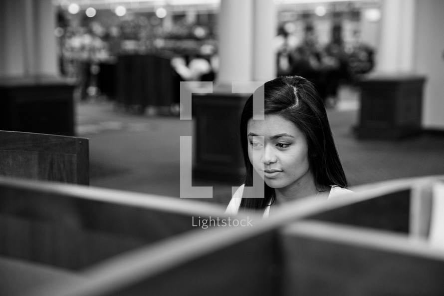 woman in a cubicle in a library 