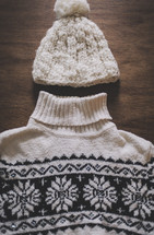 a winter sweater and knit hat
