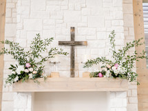 cross and flowers on an altar 