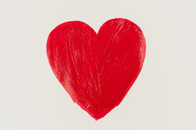 painted red heart on white paper 
