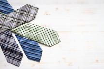 neckties on a wood background 