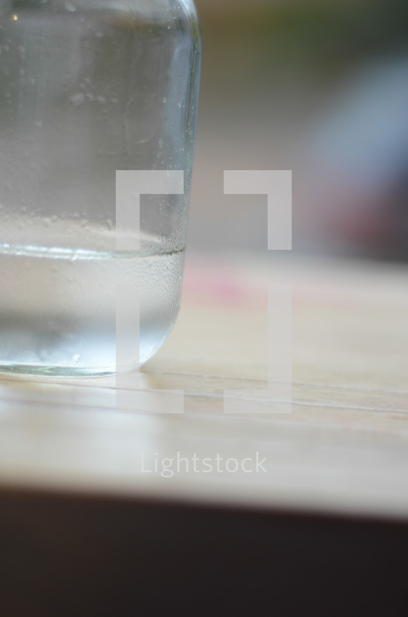 water in a mason jar on a counter 