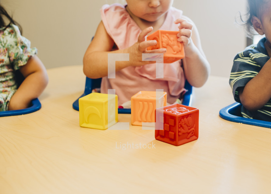 toddlers playing with blocks 