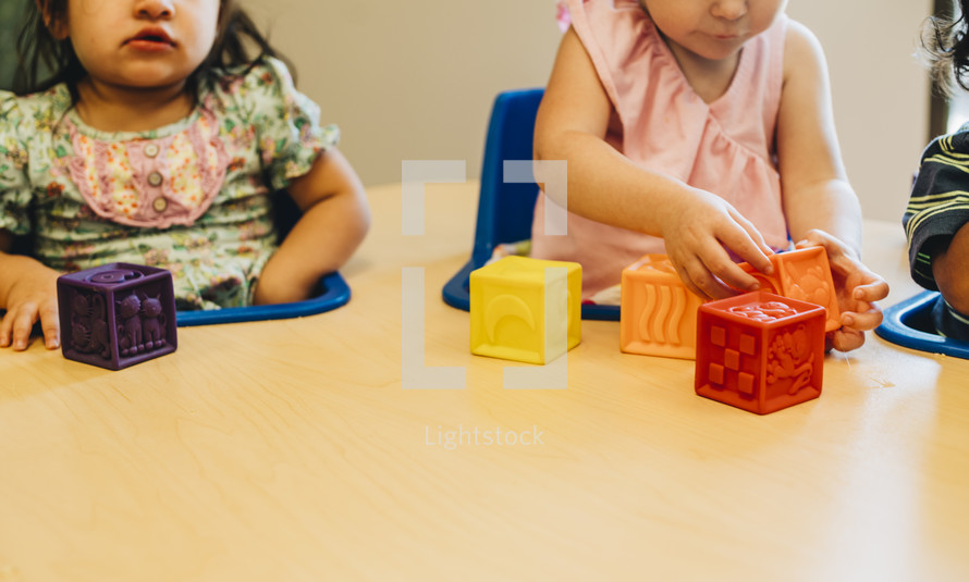 toddler playing with blocks 