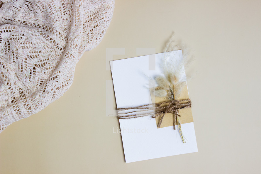 envelope with flowers in twine 