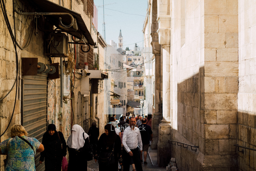 people walking on the narrow streets of Jerusalem 