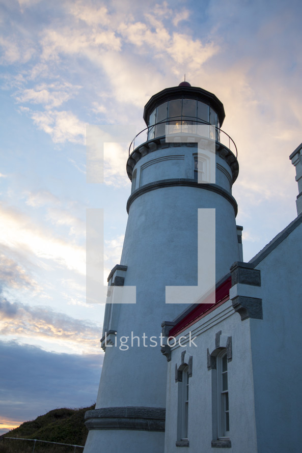 a lighthouse at sunset 
