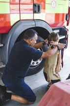 a child visiting a fire station 