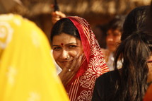 woman with Bindi touching her face 