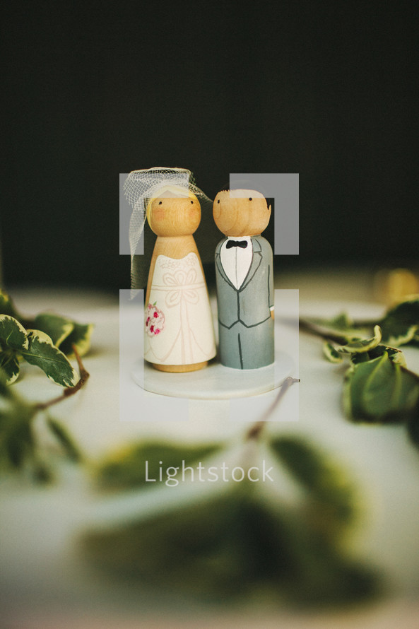 painted wood craft of bride and groom 